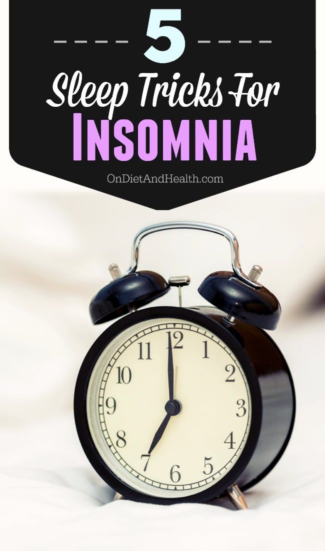 alarm clock on comforter