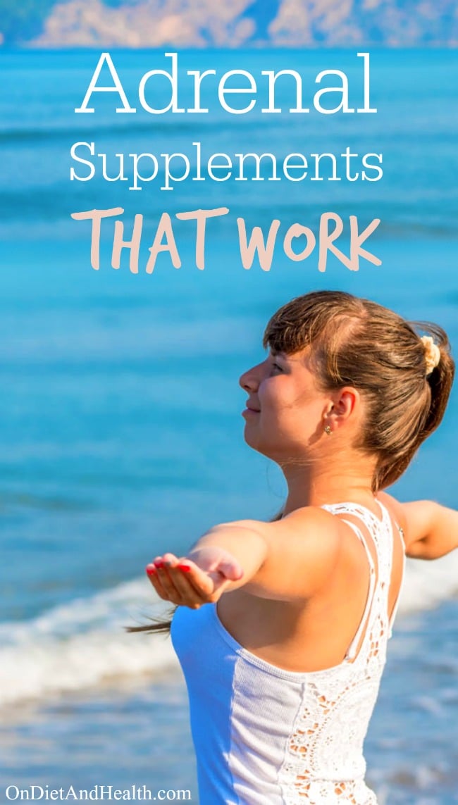 Woman at beach stretching arms wide