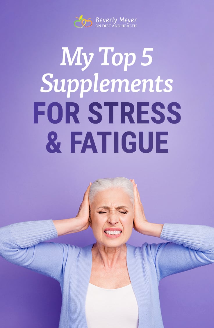 An older woman looks very stressed, holding her head and squeezing her eyes shut.