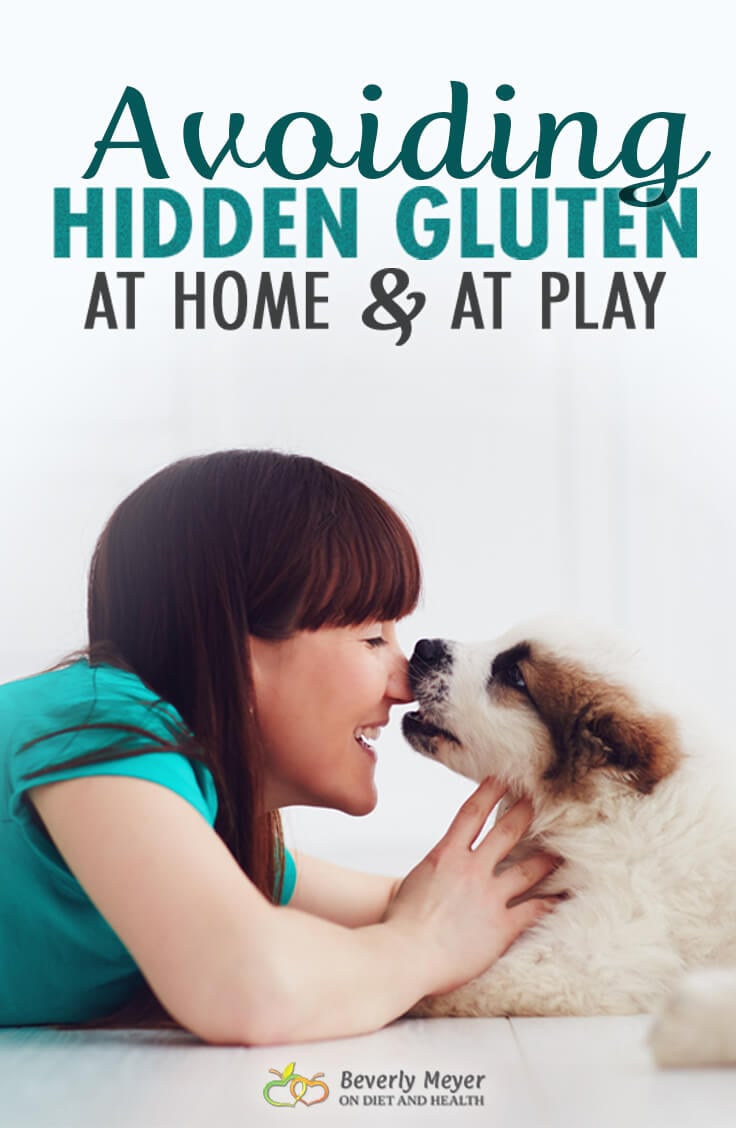 Young woman kissing her puppy on the nose. Is there gluten on that puppy's nose?