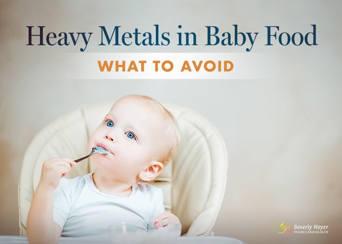 A blue-eyed baby eats from a spoon