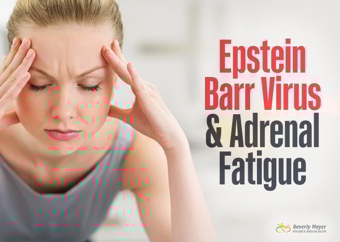 A tired looking woman with Epstein Barr and Adrenal Fatigue holds her head with her eyes closed